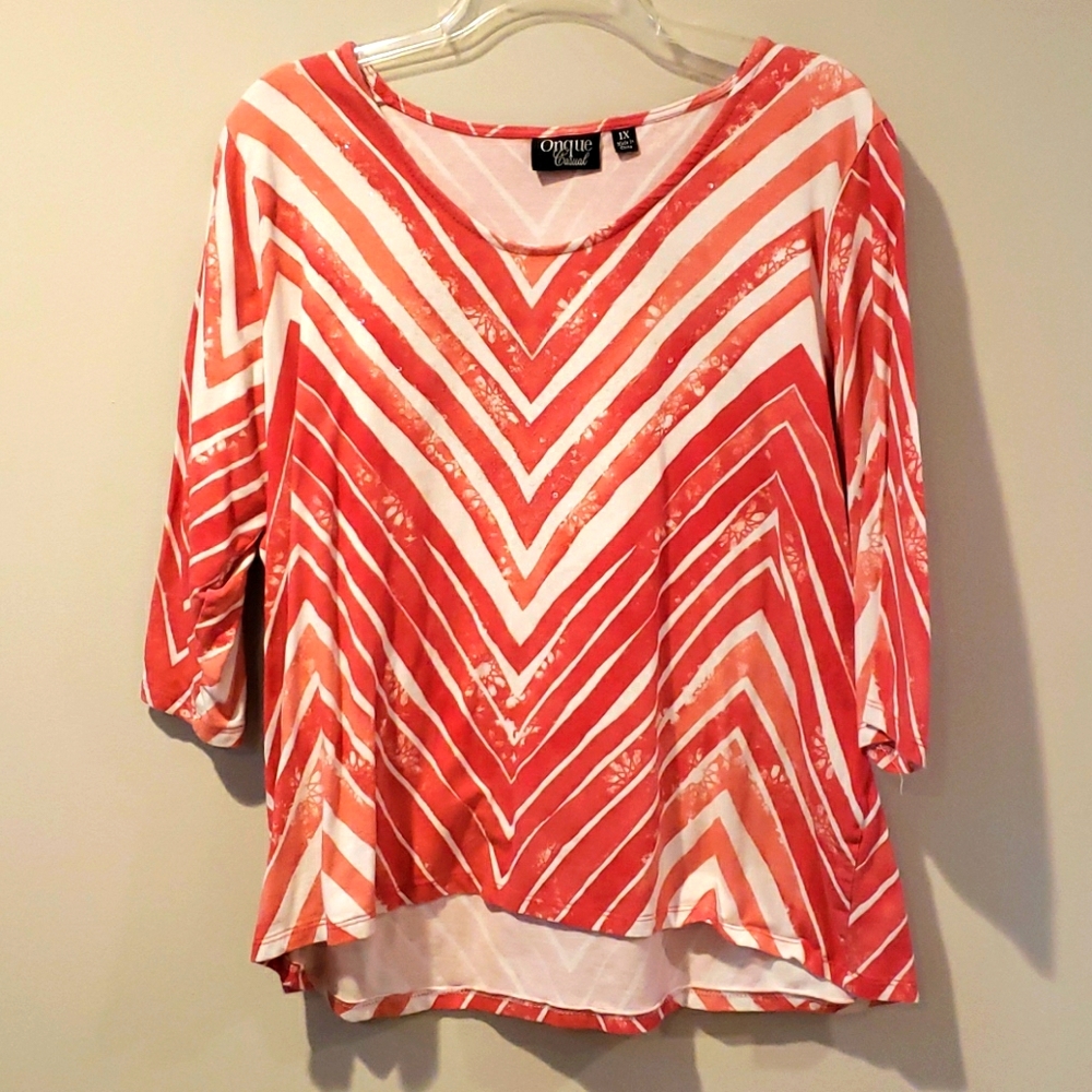 Sparkly deep coral shirt.